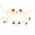 The Girls Elephant Charm Jewelry Set includes adjustable pieces such as a necklace, bracelet, earrings, and ring. Each item is adorned in gold with silver accents and features vibrant red ladybird designs. Displayed on a white background, the set highlights the intricate details and colorful charm of the ladybirds.